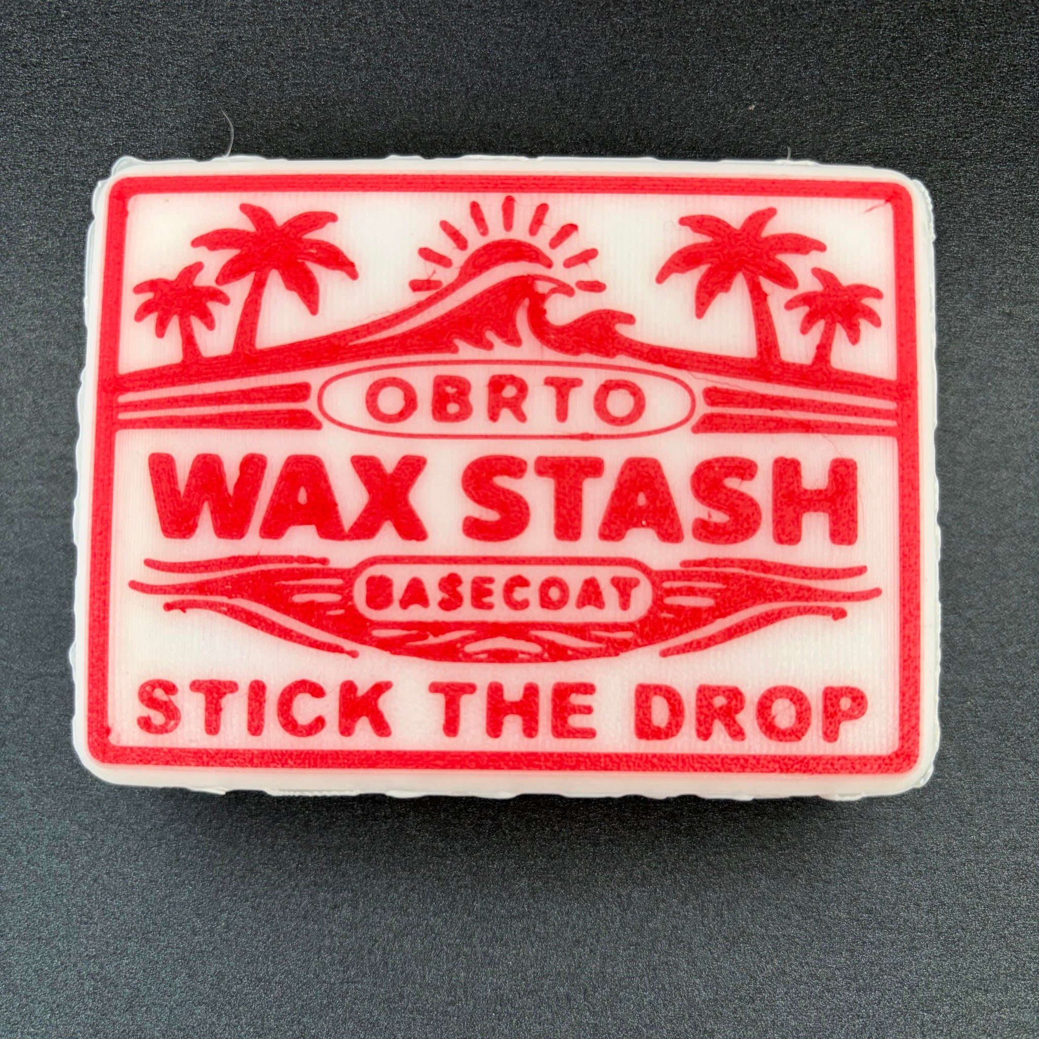 Red and white wax stash with basecoat label surf wax holder