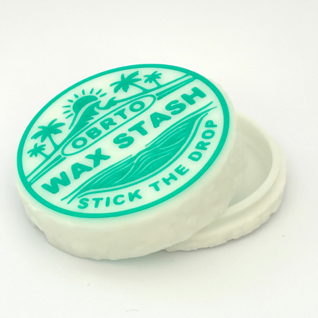 Wax stash container with green lid and white base on a white background