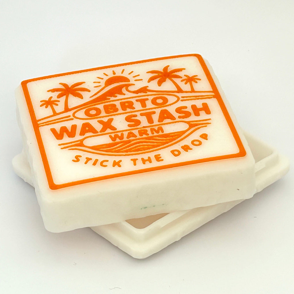 Wax stick with orange label on a white background